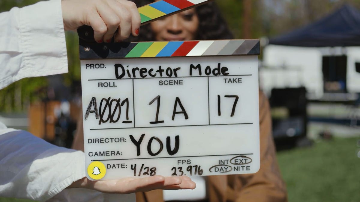 Director's clapboard getting ready to snap shut.