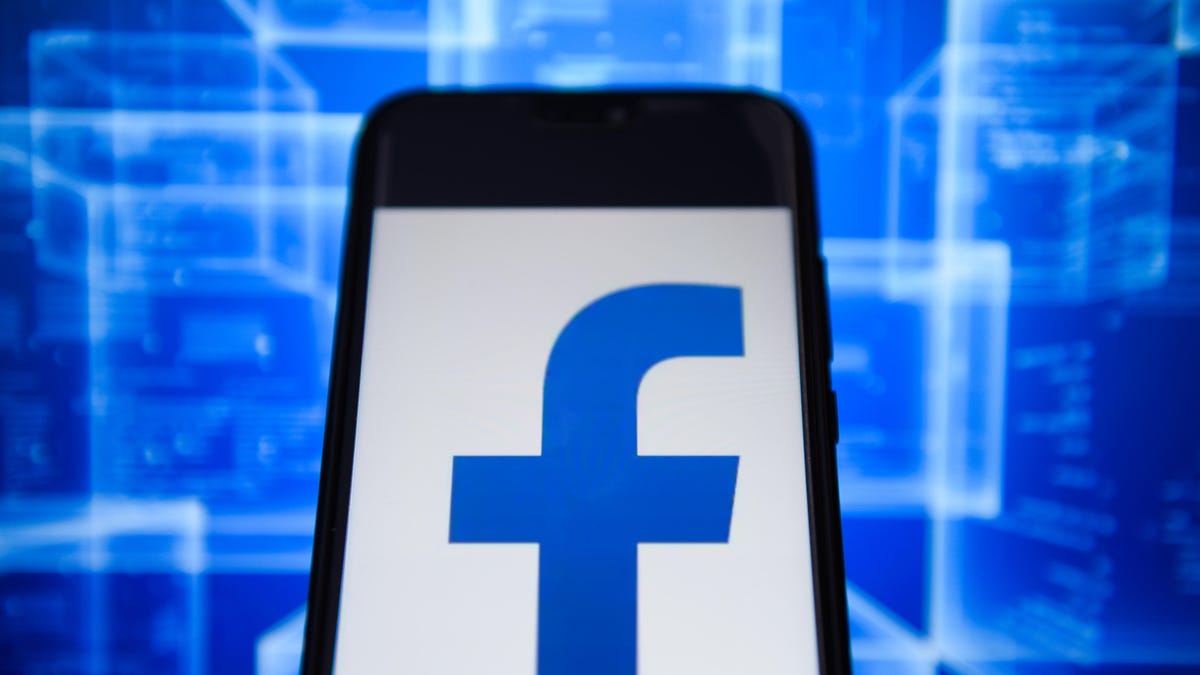 Facebook logo is seen on an android mobile phone