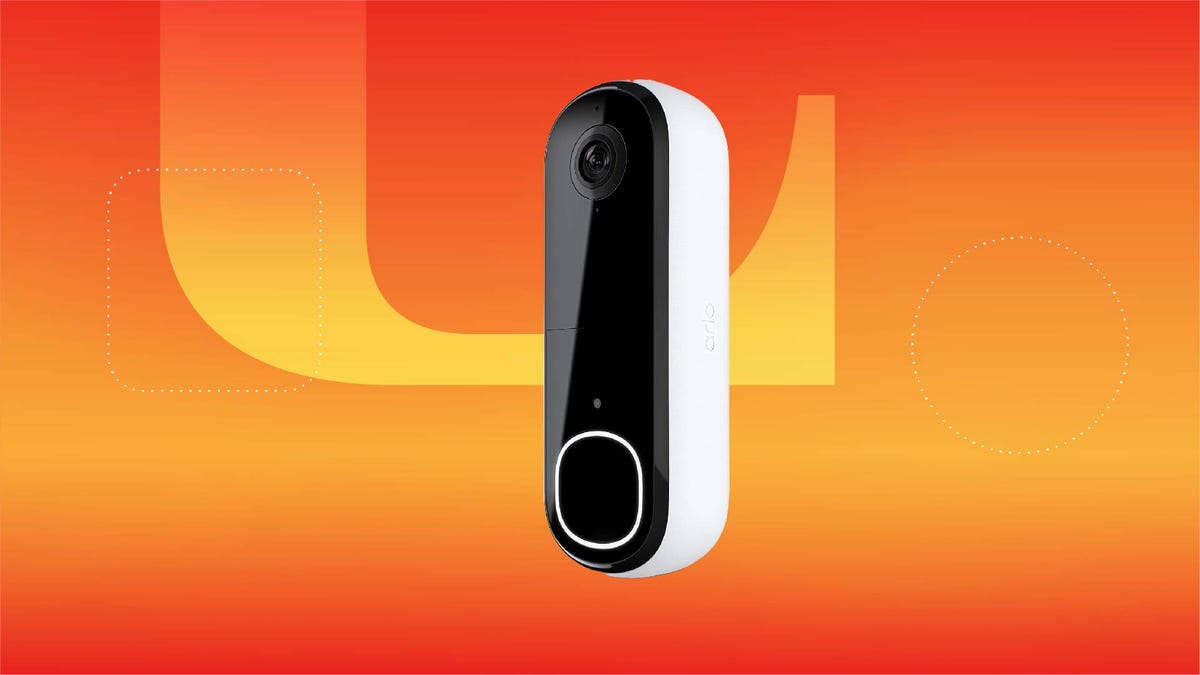 A white and black video doorbell against an orange gradient CNET background.