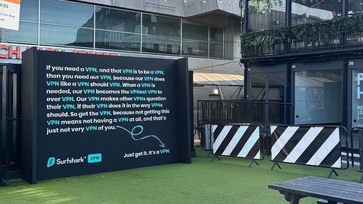 A text-heavy billboard talking about VPNs in an urban locale.