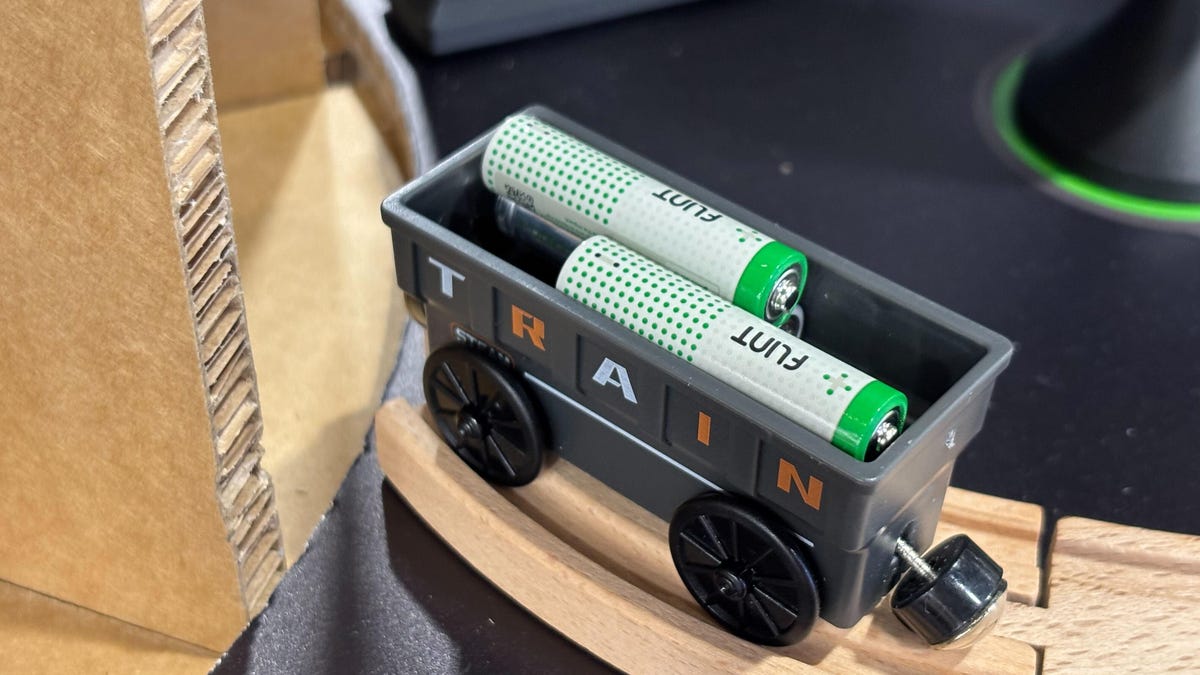 Two Flint batteries in a model train car.