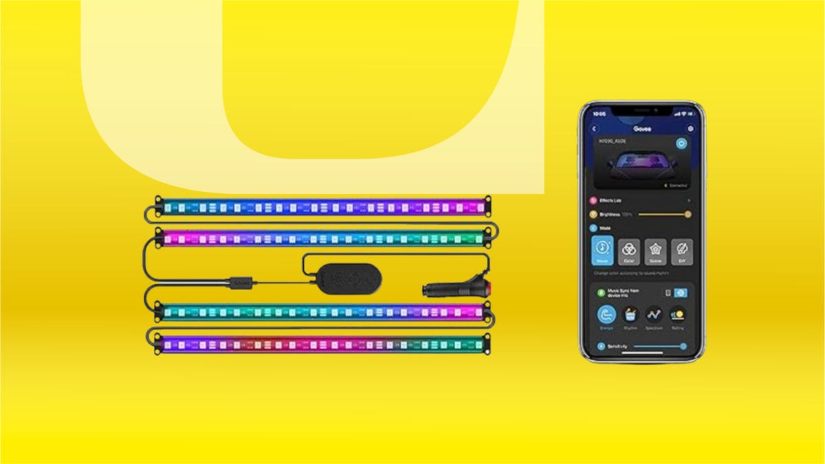 LED car lights and a smartphone against a yellow background.