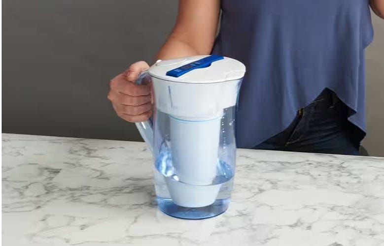 zero water pitcher being held on counter