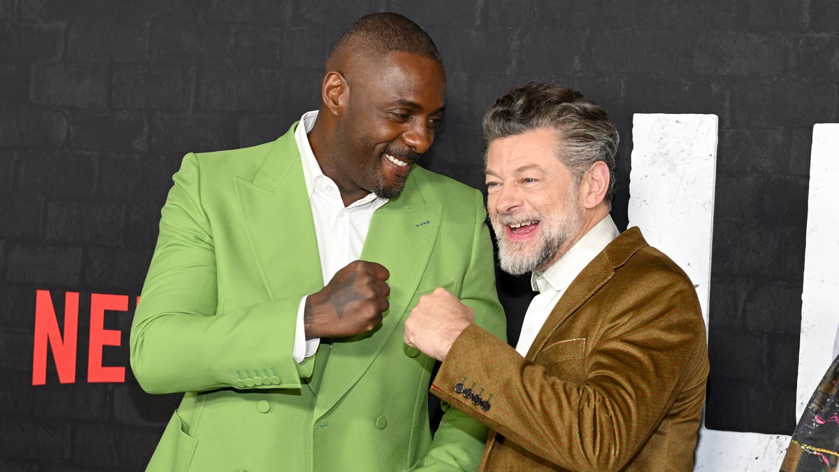 Idris Elba gives Andy Serkis a fist bump