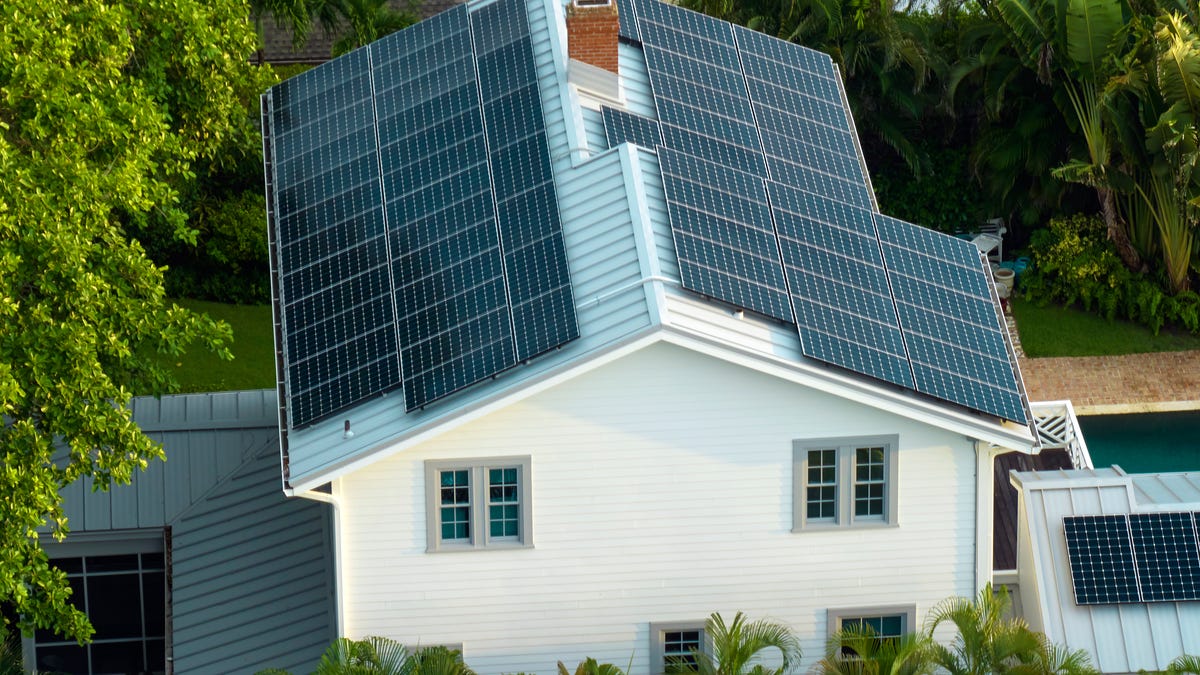 A house with a lot of solar panels on it.