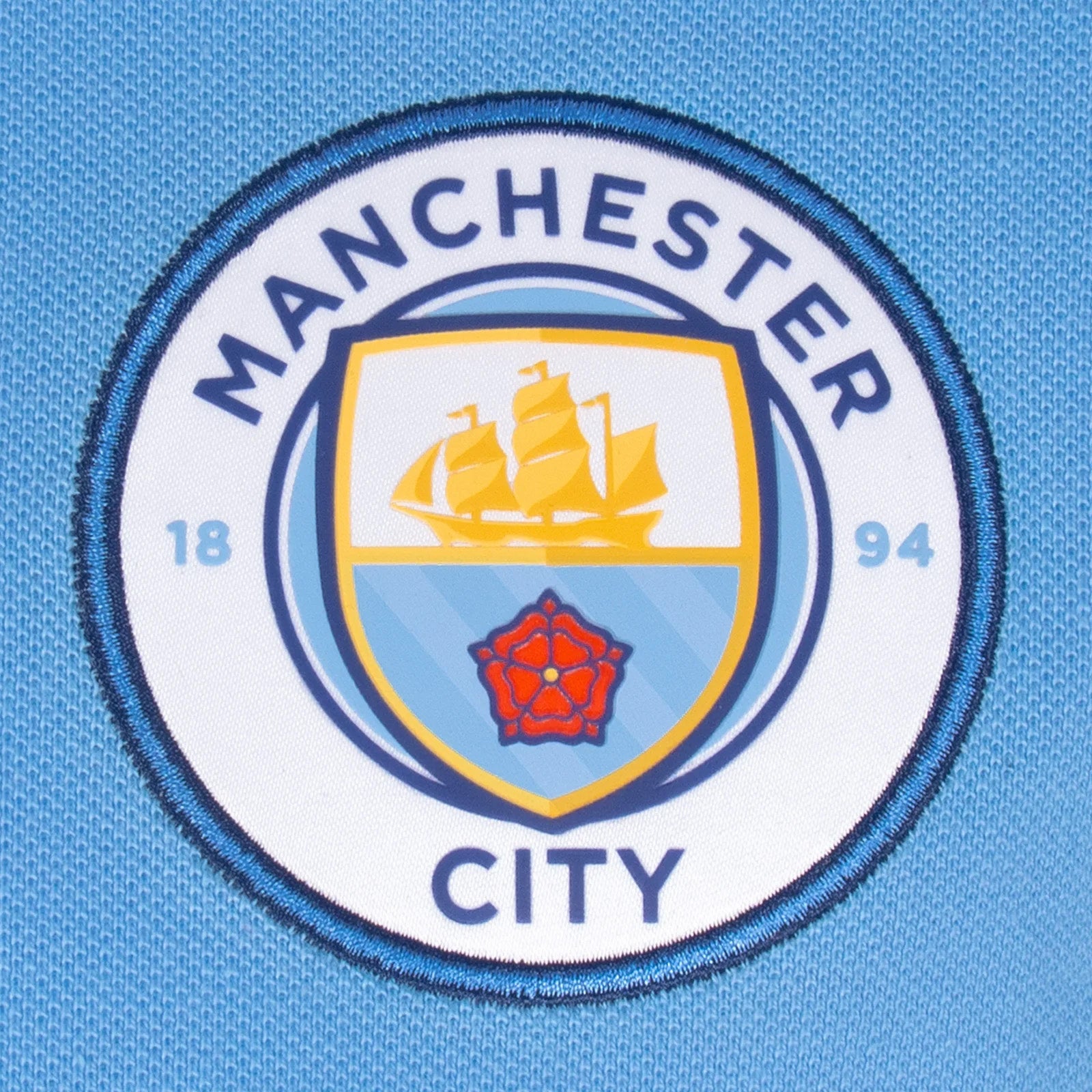 Man City kids polo shirt in grey with club crest to the chest.