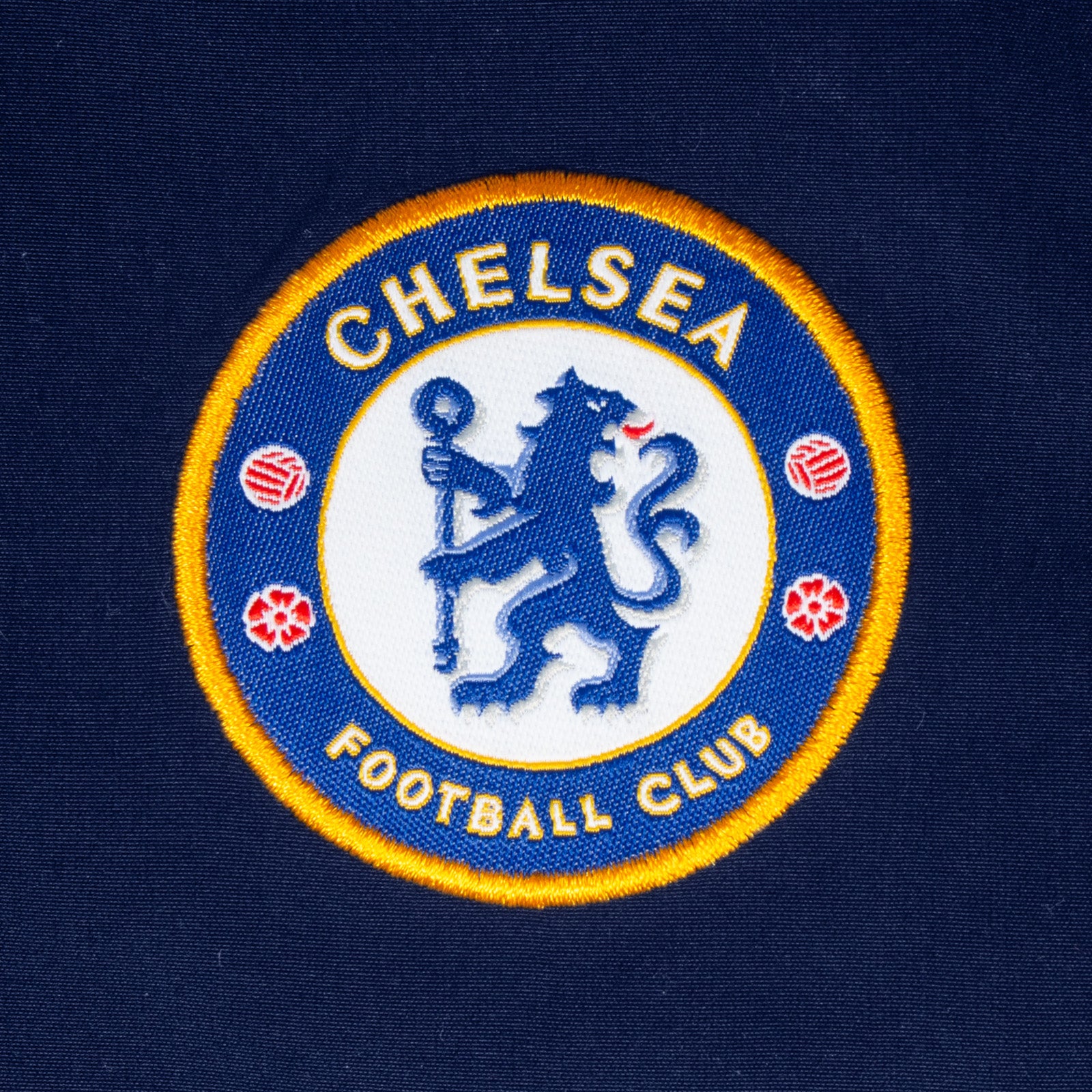 Chelsea adults tracksuit in navy blue with club crest to chest and left thigh
