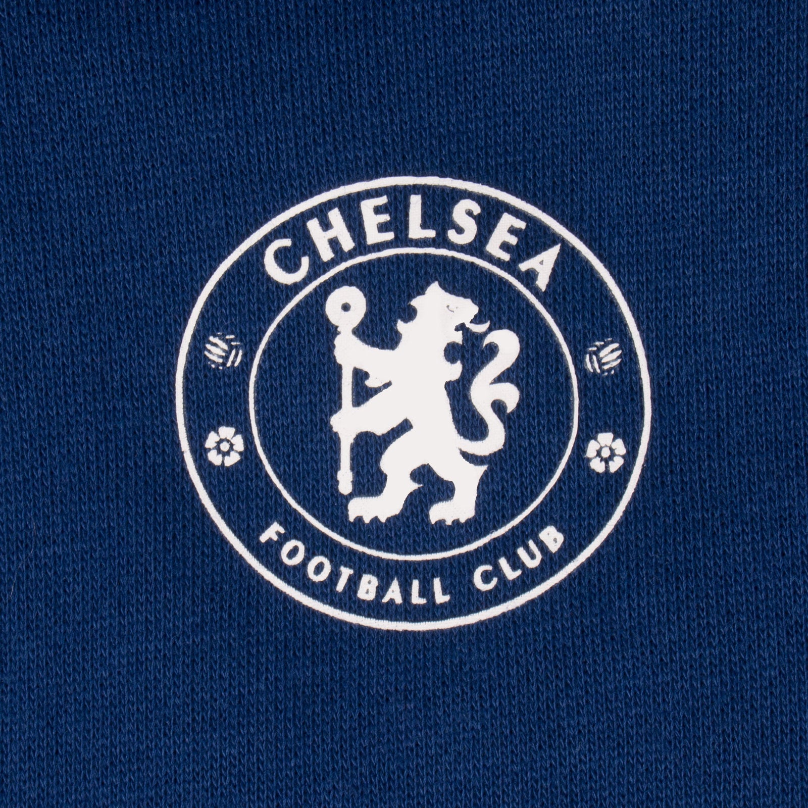 Chelsea kids slim fit track pants in blue with Chelsea 1905 text and club crest on left leg.