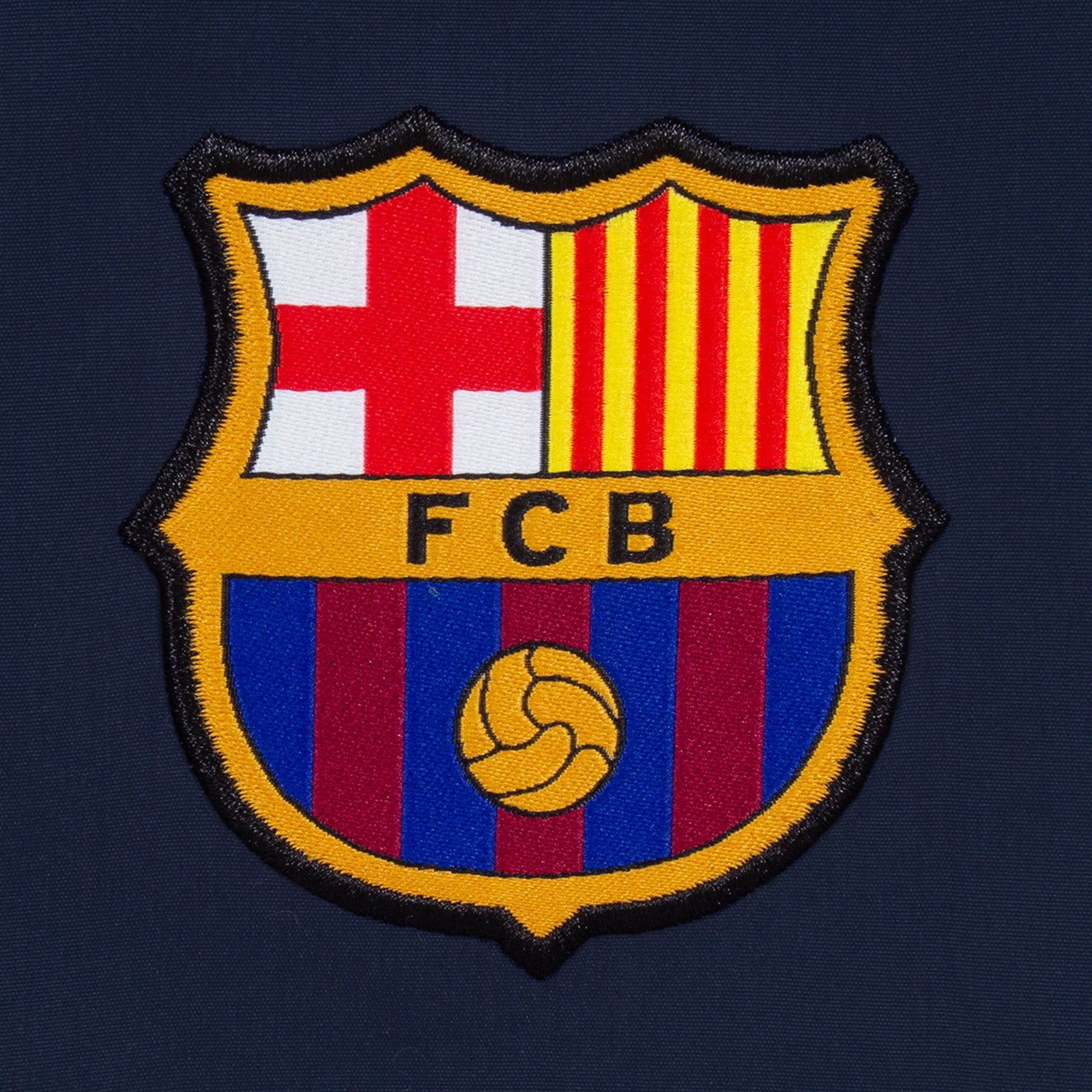 FC Barcelona kids tracksuit in navy blue with club crest to chest and left thigh