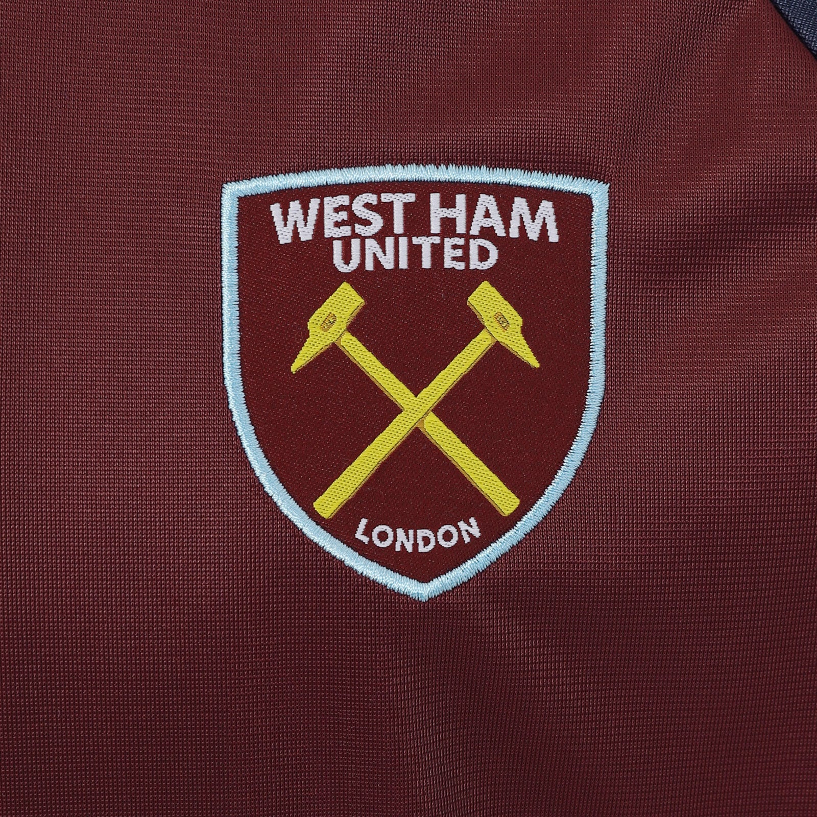 West Ham kids retro track jacket in navy blue with club crest to chest.