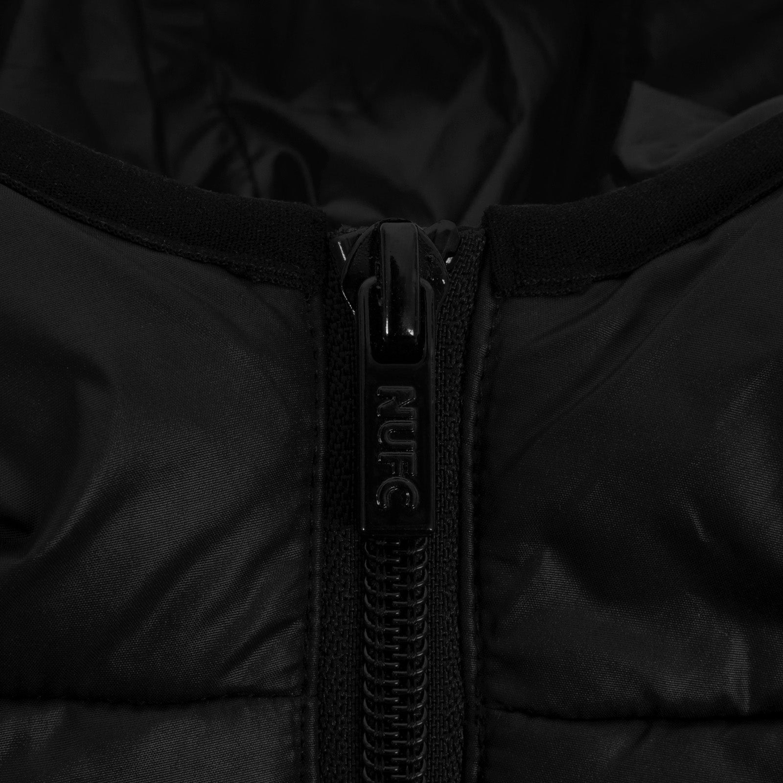 Newcastle United kids quilted jacket in black with club crest to chest.