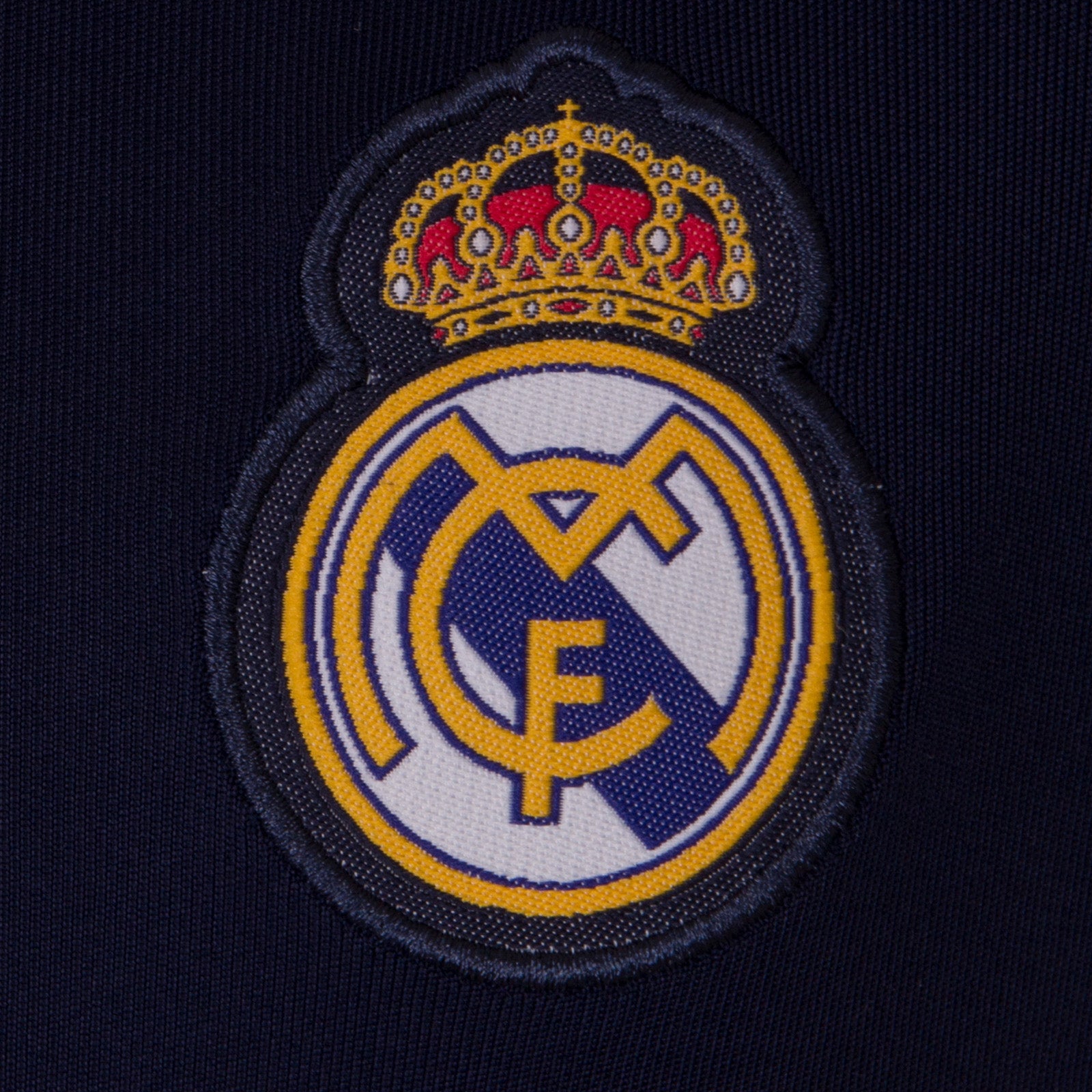Real Madrid kids V-neck T-shirt in navy blue with woven club crest to chest