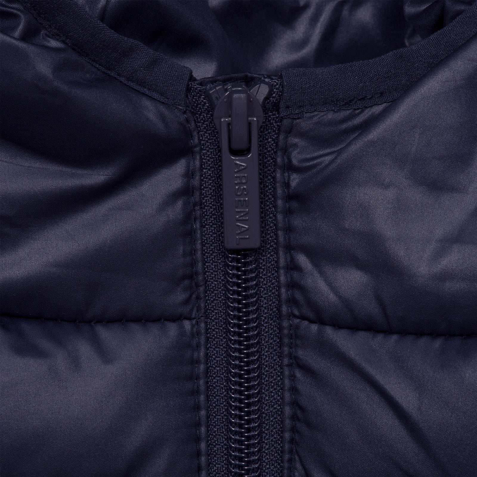 Arsenal kids quilted jacket in navy blue with club crest to chest.