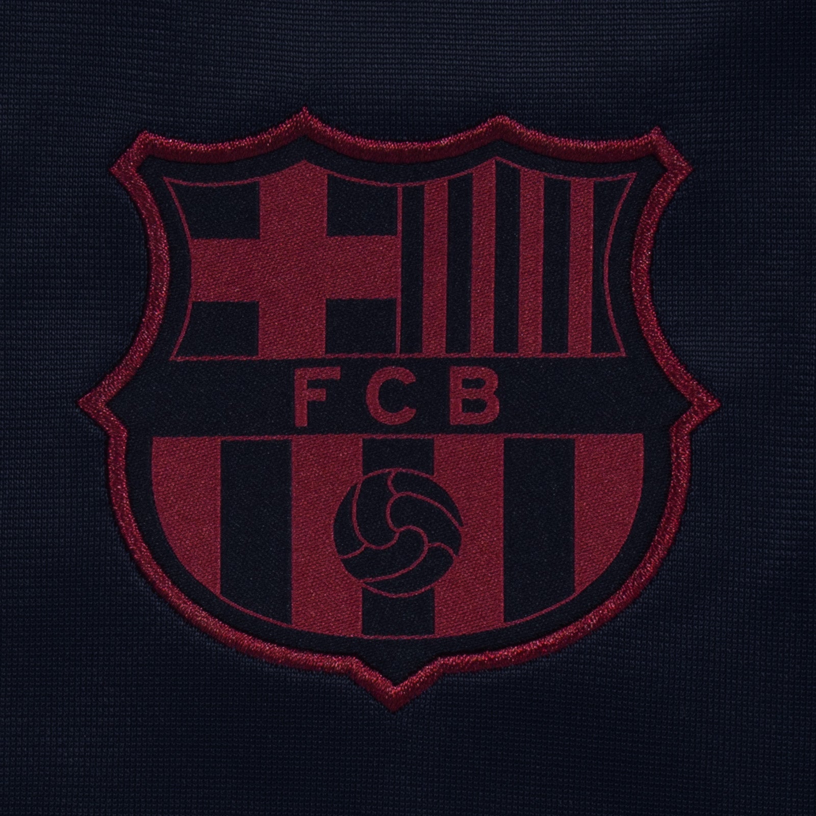 FC Barcelona kids taped tracksuit in navy blue with club crest and text to both top & pants