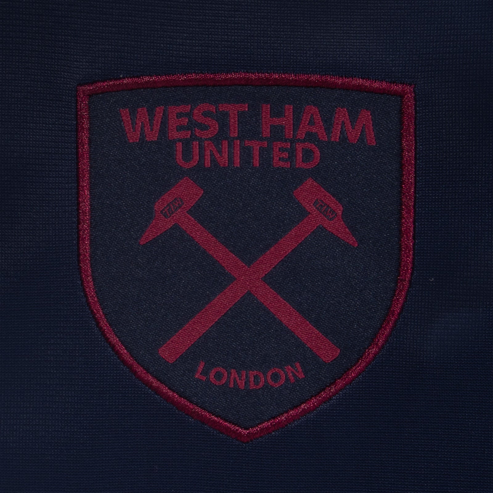 West Ham United adults taped tracksuit in navy blue with club crest and text to both top & pants