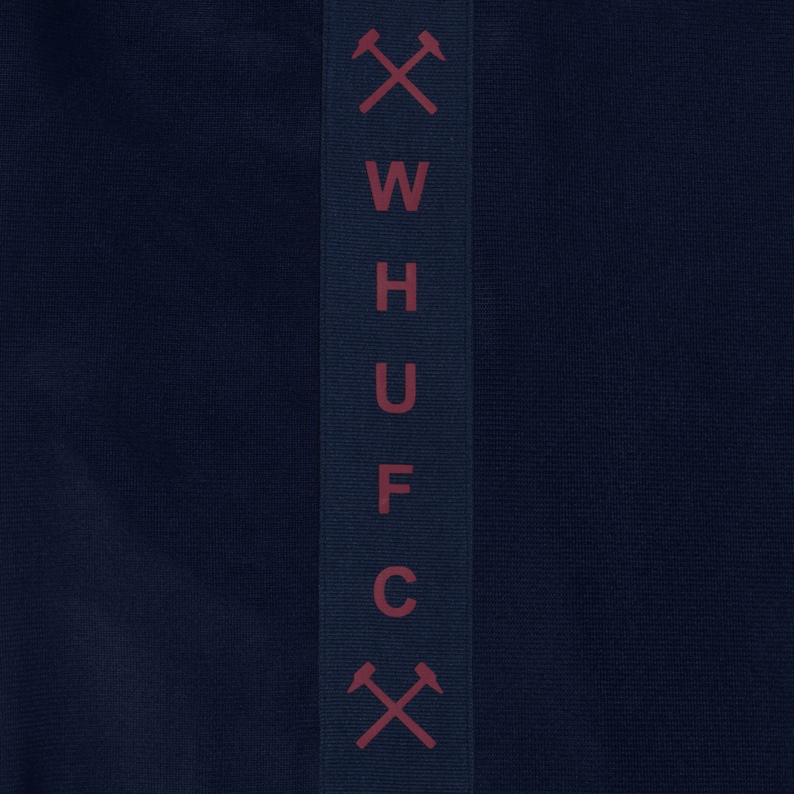 West Ham United kids taped tracksuit in navy blue with club crest and text to both top & pants